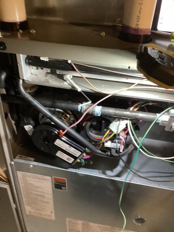 Performed scheduled Air Care Heating and Cooling maintenance on Lennox furnace system. Inspected internal components including blower motor assembly, electrical connections, and control board - all found in normal working condition with no visible damage. Examined and verified proper function of exhaust/intake venting system with appropriate PVC piping.