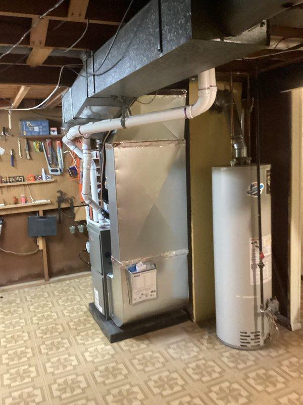 Successfully installed complete HVAC system including a 70,000 BTU furnace and 2-ton Lennox air conditioning unit with proper mechanical and electrical connections. System installation included ductwork modifications, liner installation, and all necessary permits were obtained for mechanical and electrical work.