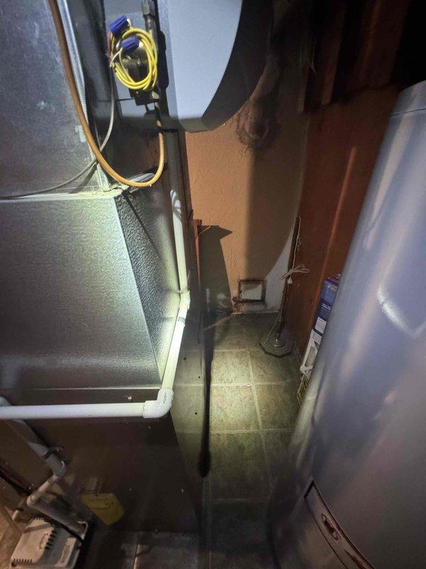 Conducted full system evaluation of 16-year-old AC unit in residential mechanical room. Inspected existing furnace, ductwork, and condensate lines for potential replacement. Documented equipment condition with photographs, noting age of system and current configuration in preparation for imminent full system replacement quote.