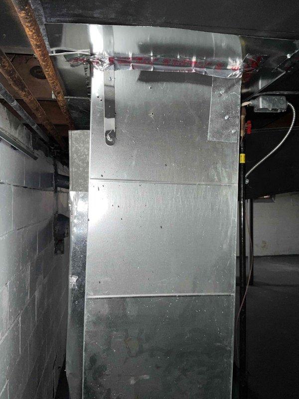 Completed assessment for installation of new air conditioning system in customer's property with no existing AC. Inspected the utility space with exposed joists and concrete block walls where the new system would be installed. Documented current conditions with photographs and provided customer with information on available promotional offers for new AC installation.