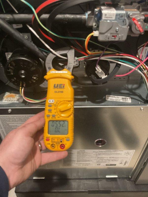 Performed annual maintenance on a 10-year-old furnace system. Conducted electrical diagnostics using clamp meter to verify proper amperage readings on blower motor and control circuits. Inspected internal components including circuit board, gas valve assembly, and wiring connections - all found in normal working condition with no visible issues. System is operating correctly with maintenance completed as scheduled.