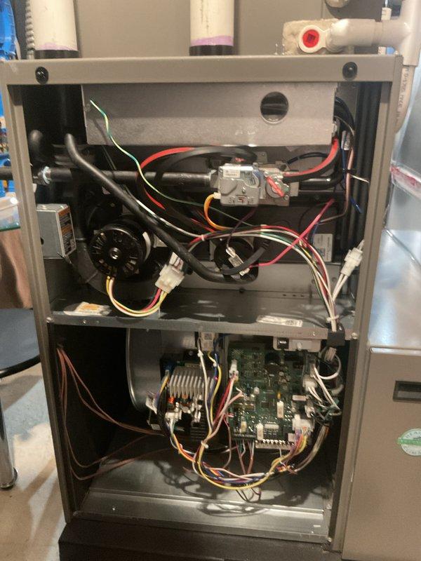 Performed annual maintenance on a 10-year-old furnace system. Conducted electrical diagnostics using clamp meter to verify proper amperage readings on blower motor and control circuits. Inspected internal components including circuit board, gas valve assembly, and wiring connections - all found in normal working condition with no visible issues. System is operating correctly with maintenance completed as scheduled.