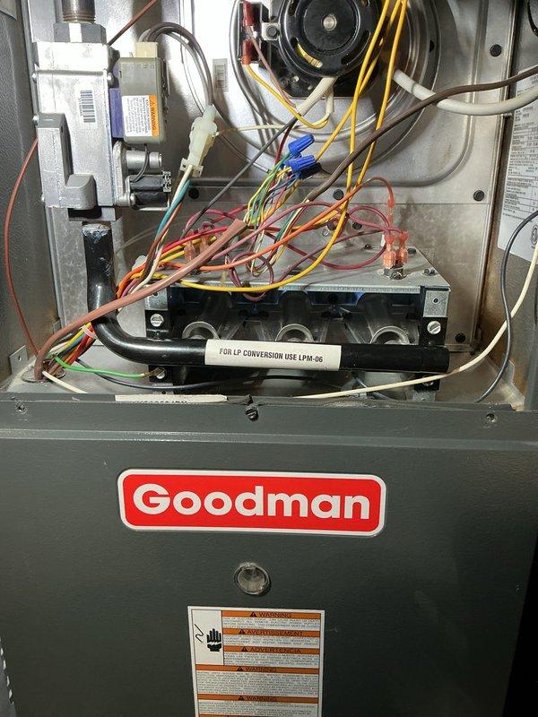 Performed scheduled air handler maintenance on Goodman HVAC system. Inspected interior components including blower wheel, electrical connections, and gas valve assembly. Verified proper LP conversion kit installation and confirmed all safety systems functioning correctly.