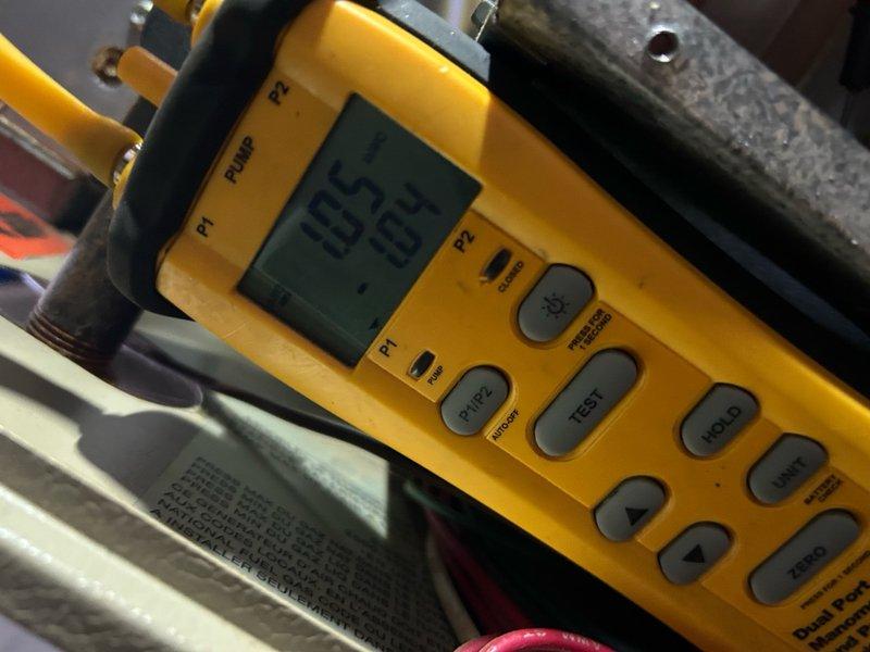 Performed diagnostic testing on 20-year-old furnace experiencing intermittent short cycling and heating issues. Conducted comprehensive electrical measurements using multimeter (32.01V/0.000A readings) and pressure/temperature testing (185/107 readings) to identify system performance parameters. Completed full inspection and testing sequence to address the reported heating inconsistencies.