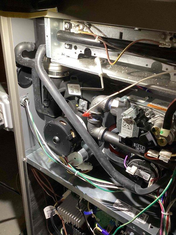 Performed annual heating maintenance on furnace (0 years old, contract through 2025). Conducted thorough inspection of interior mechanical components including pipes, valves, control modules and wiring connections. System is operating properly with all components clean and in good working condition; no visible damage, leaks or deterioration detected.