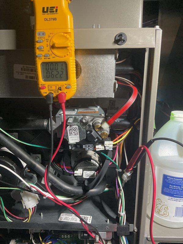 Performed annual furnace maintenance with comprehensive electrical testing using UEi DL379B clamp meter, measuring voltage and current values across system components. Inspected gas valve connections and control module functionality, confirming proper operation with readings of 82.10 on primary circuits. All components functioning within manufacturer specifications; system is ready for the upcoming heating season.