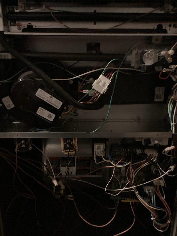 Performed diagnostic inspection and tune-up on 2-year-old Lennox WT 10-2033 system that was reported non-operational with humidifier leakage. Opened access panels to examine internal components including blower assembly, circuit boards, and electrical connections. Identified and resolved moisture issue from humidifier affecting unit operation and completed standard maintenance procedures on both air handler and furnace systems to restore proper functionality.