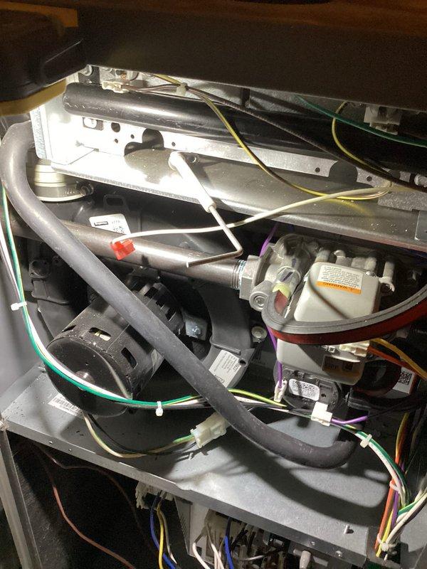 Completed annual furnace maintenance service including comprehensive inspection of internal components, electrical connections, and gas valve assembly. Documented condition of blower motor, control board, and wiring harness with photos for service record. System is functioning properly with no issues identified; next maintenance recommended in 2025.