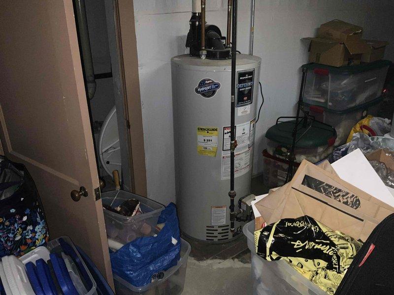 Provided quote for replacement of 15-year-old non-functional natural gas furnace as part of BOGO promotion that includes AC unit #7. Equipment is located in customer's basement with existing water heater and PVC plumbing infrastructure.