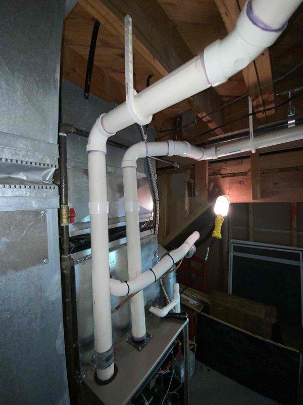 Provided quote for replacement of 15-year-old non-functional natural gas furnace as part of BOGO promotion that includes AC unit #7. Equipment is located in customer's basement with existing water heater and PVC plumbing infrastructure.