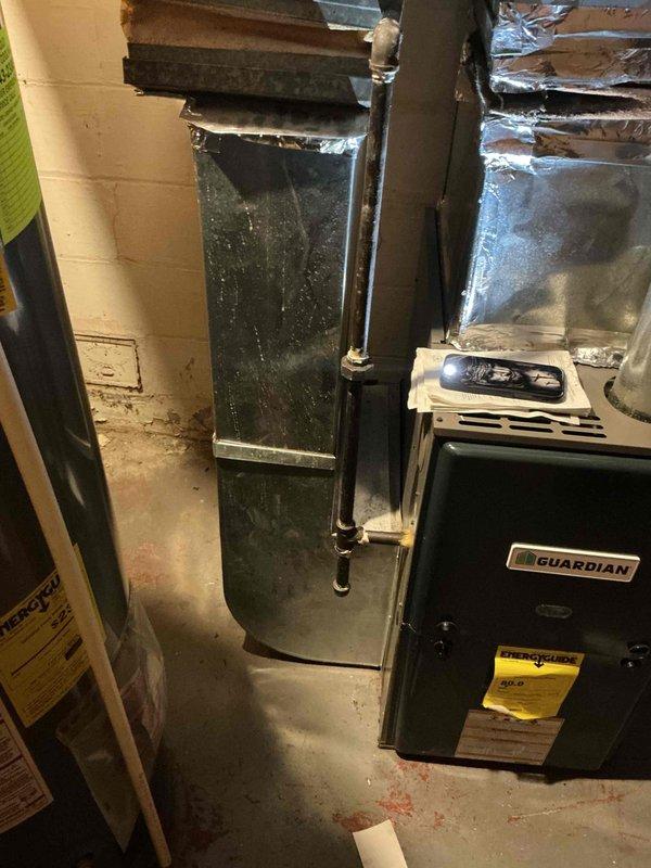 Conducted a replacement estimate for a residential HVAC system, specifically focusing on central air conditioning unit replacement requested by customer planning implementation within one month. Inspection revealed an existing Guardian furnace system with standard ductwork configuration in utility room, and documented the electrical service panel to verify adequate power supply capacity for the proposed new AC unit.