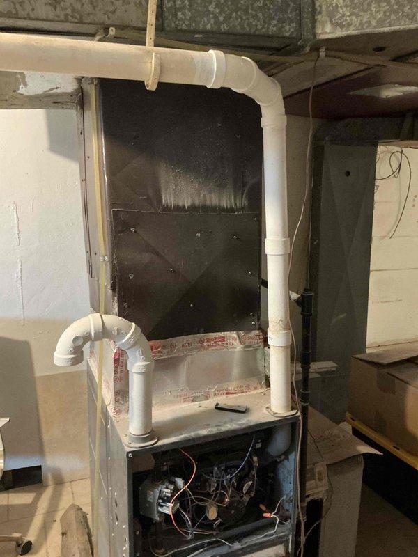Conducted comprehensive inspection of 2019 furnace and A/C system located in basement. Unit is currently operational but customer is seeking replacement options. Examined exposed internal components, wiring, and ventilation system including PVC exhaust piping. Customer inquired about promotional offers and Costco program affiliation.