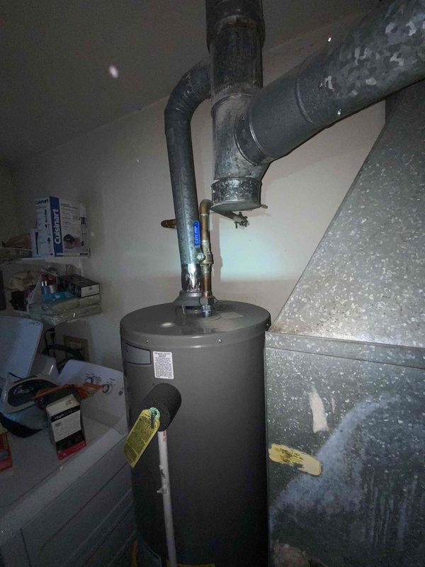 Conducted comprehensive assessment of 1999 furnace and A/C system located in basement. Unit is currently operational but nearing end of service life (24 years old). Inspection revealed aging water heater with visible corrosion at pipe joints and deteriorating ductwork throughout the HVAC system. Provided replacement estimate for complete system upgrade.