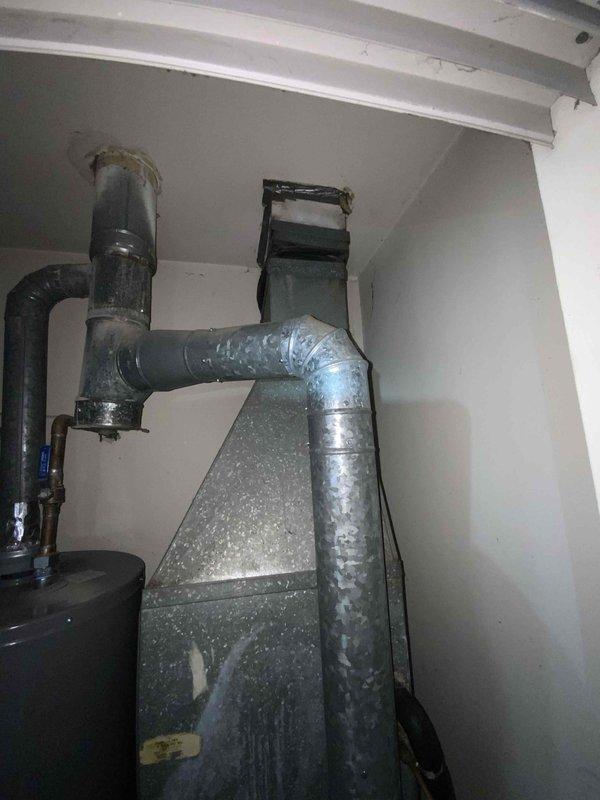 Conducted comprehensive assessment of 1999 furnace and A/C system located in basement. Unit is currently operational but nearing end of service life (24 years old). Inspection revealed aging water heater with visible corrosion at pipe joints and deteriorating ductwork throughout the HVAC system. Provided replacement estimate for complete system upgrade.