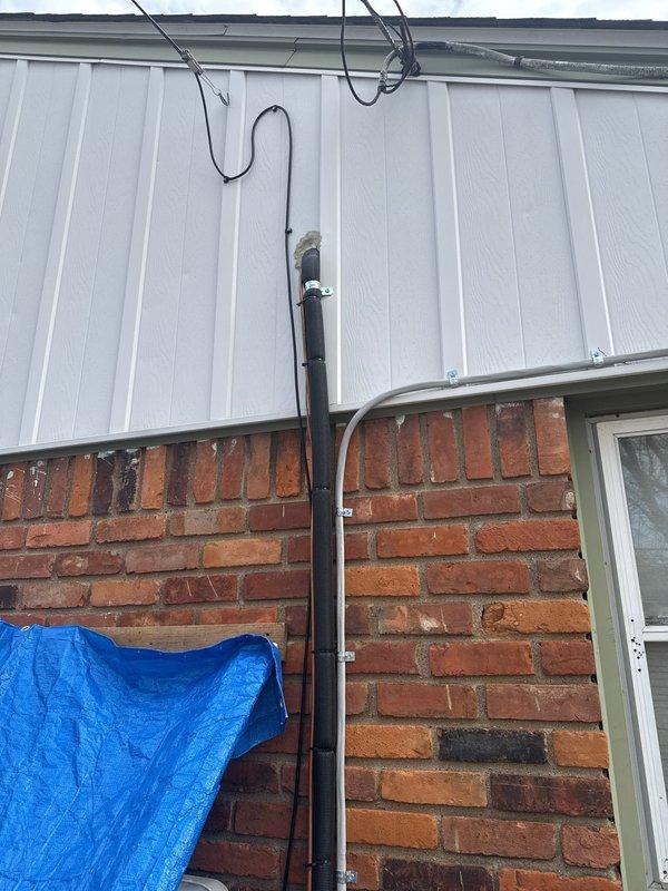 Completed insulation of suction line per violation repair requirements. Inspected outdoor unit installation with proper electrical connections to the 2-ton AC system. Verified all mechanical and electrical components are functioning correctly following the furnace and AC installation.