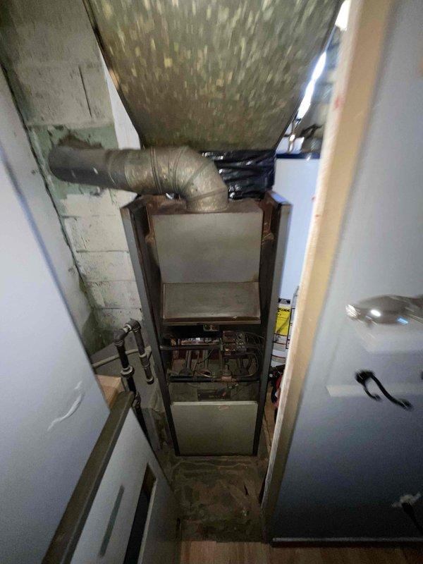 Conducted comprehensive assessment of 16-year-old furnace system exhibiting significant wear, dust accumulation, and potential deterioration of surrounding building materials. Visual inspection revealed aging control panel components, compromised ductwork insulation, and discoloration on cabinet surfaces. Provided customer with replacement options and timeline for installation within the next couple weeks as requested.
