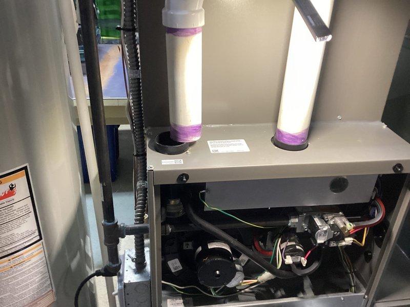 Performed annual furnace maintenance on homeowner's system through Air Care Membership. Conducted comprehensive inspection of furnace components including motor assembly, gas valve, electrical connections, and venting system with proper PVC connections. All systems tested and functioning normally; no issues identified during the preventative maintenance service.