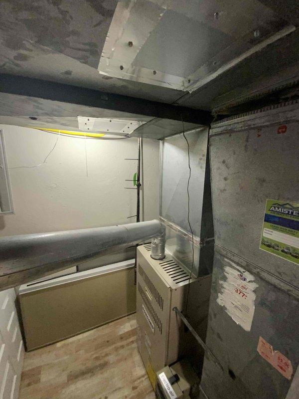 Conducted assessment of 18-year-old basement gas furnace and AC system. Customer is seeking replacement for improved efficiency. AC unit requires relocation. Current equipment is operational but aging. Documented existing installation with photos for replacement planning purposes.
