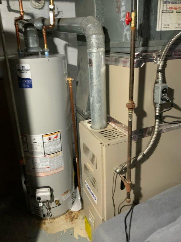 Conducted comprehensive assessment of 15-year-old AC and furnace system for potential replacement under promotional offer. Documented existing installation in utility room, noting current configuration of furnace with connected ventilation ductwork adjacent to water heater. Customer is prepared to proceed with full system replacement as quoted in estimate #126460-04.