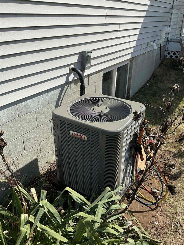 Successfully installed a complete HVAC system including a 90K BTU furnace and 3-ton Lennox air conditioning unit. The installation involved proper positioning of the outdoor condenser unit adjacent to the foundation wall with appropriate electrical conduit and refrigerant line connections, while the indoor furnace was installed in the basement mechanical room with PVC exhaust venting and proper ductwork integration.
