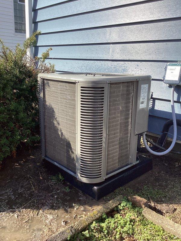 Performed scheduled ComfortGuard Maintenance service on residential AC system. Inspected outdoor condenser unit showing normal wear and dirt accumulation; unit is functioning properly and mounted securely on appropriate pad. Checked electrical connections and refrigerant lines; all components in working order with no immediate concerns identified.