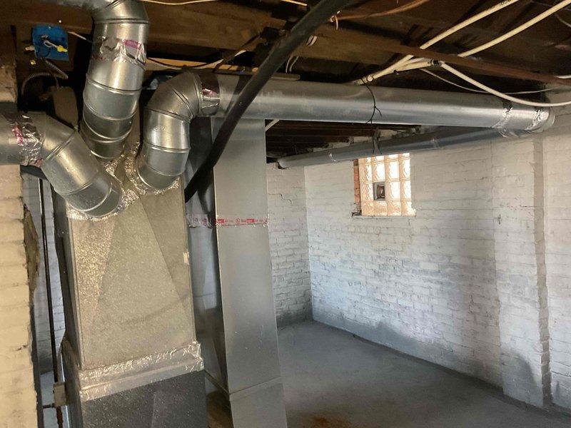 Conducted site visit to assess non-operational furnace in basement. Inspection revealed aging natural gas furnace with visible wear on connection points and ductwork. Customer previously scheduled for system replacement but cancelled; recommended proceeding with previously quoted furnace replacement due to complete system failure.