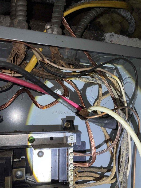 Conducted site assessment for new whole home generator installation. Inspected existing electrical system, documenting deteriorated wiring with visible insulation wear and disorganized cable management. Evaluated exterior Connecticut Electric service connection box mounted on siding for potential integration with generator system.