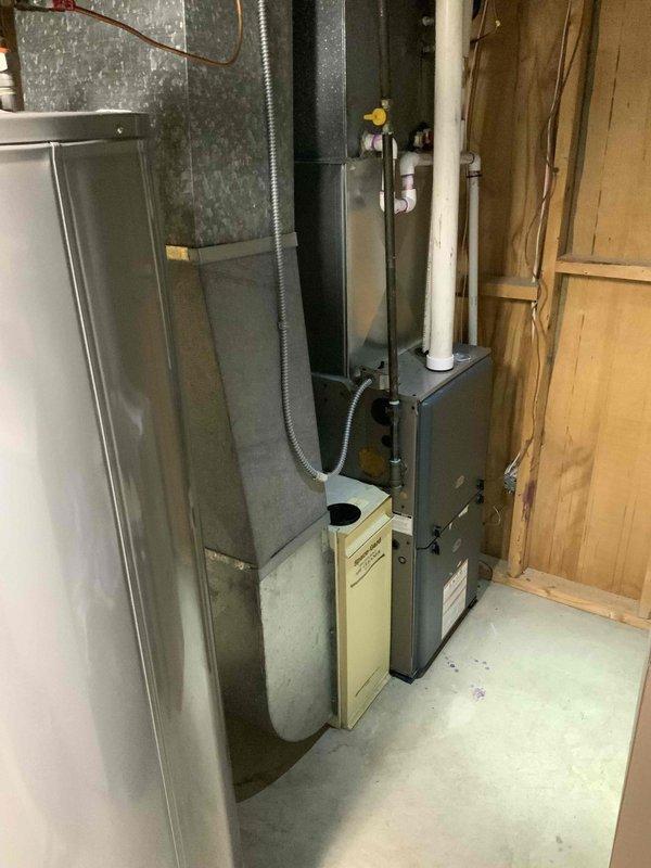 Conducted an HVAC system replacement estimate for a mid-large residence (2000-3000 sq.ft.) with a basement-located natural gas/propane system. Evaluated existing equipment including furnace unit, water heater installation with copper piping connections, and associated ductwork and humidifier components for appropriate replacement specifications.