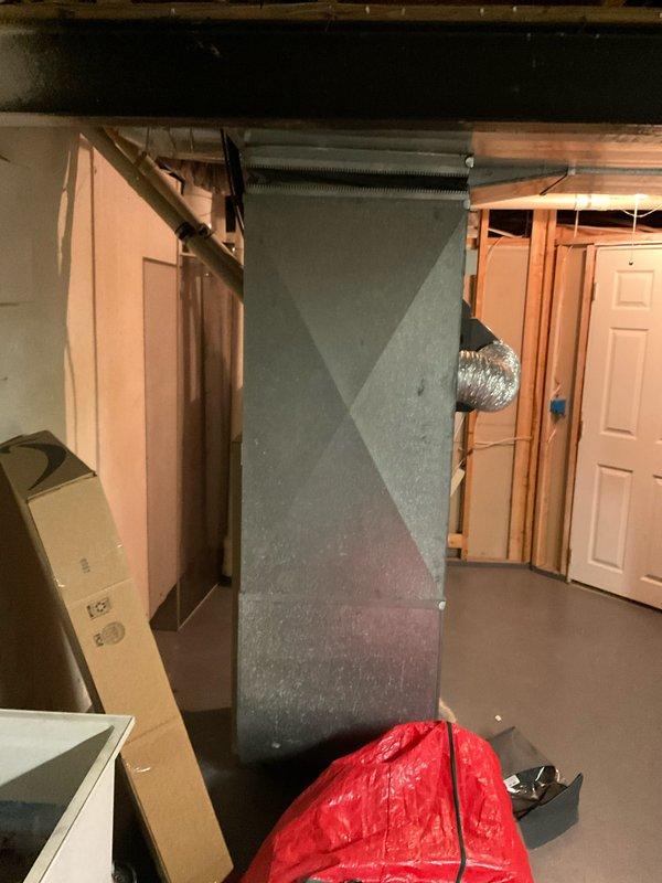 Conducted evaluation of 1999 furnace that was recently serviced but identified as reaching end of life. Inspection revealed aging electrical panel with potential wiring concerns and existing HVAC system with standard ductwork configuration in basement utility area. Provided replacement estimate for natural gas furnace with complete system specifications and installation requirements.