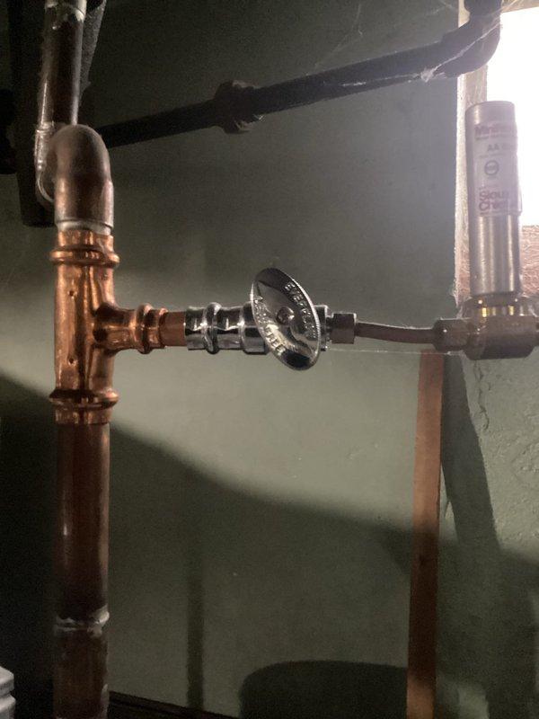 Responded to callback service for water leakage from furnace following recent maintenance. Inspected copper coil components and plumbing connections, identifying issue at valve junction where copper vertical pipes connect to horizontal black pipes. Corrected the leak under existing parts warranty.
