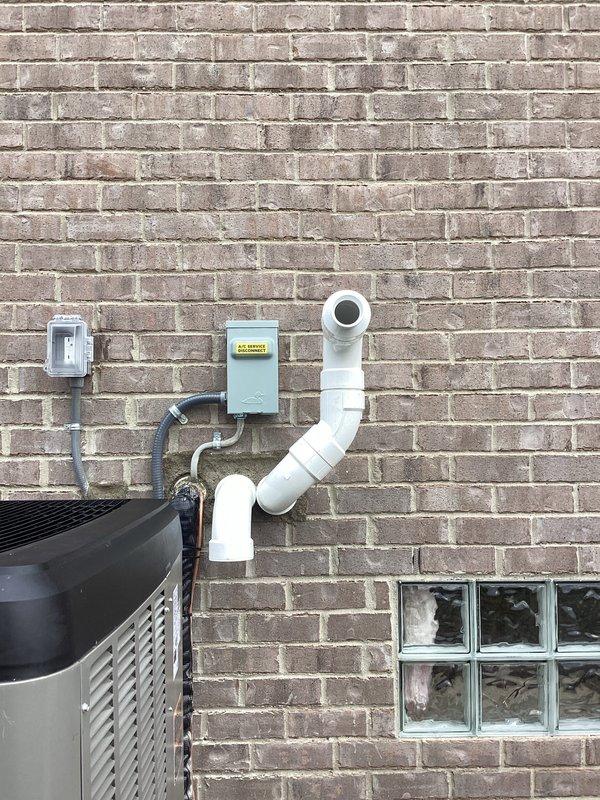 Successfully completed installation of a complete HVAC system including a 135,000 BTU furnace, 5-ton air conditioning unit, and zoning system. Connected all necessary ductwork with proper sealing, installed PVC drain lines and venting, and mounted the outdoor condenser unit against the exterior brick wall. System includes humidifier integration and all electrical connections were properly established with permits secured for mechanical and electrical work.