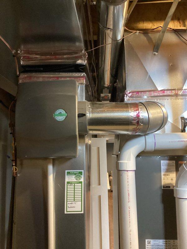 Successfully completed installation of a complete HVAC system including a 135,000 BTU furnace, 5-ton air conditioning unit, and zoning system. Connected all necessary ductwork with proper sealing, installed PVC drain lines and venting, and mounted the outdoor condenser unit against the exterior brick wall. System includes humidifier integration and all electrical connections were properly established with permits secured for mechanical and electrical work.
