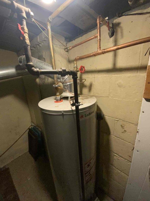 Conducted an estimate for replacement of a 30-year-old furnace and A/C system located in the basement. Inspection revealed aging equipment with natural gas fuel source. Documented existing mechanical room conditions, including water heater installation and copper piping configuration, to facilitate proper equipment sizing and installation planning for the proposed replacement.