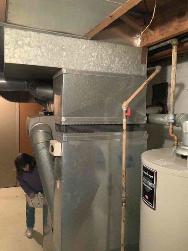 Performed a comprehensive evaluation of a 20+ year-old HVAC system, including both furnace and AC unit. Inspection revealed aging galvanized ductwork with measurements of 6"x9" and 24" sections in the utility room. Customer is seeking replacement options for a new two-stage furnace and potentially the AC unit within the next month.