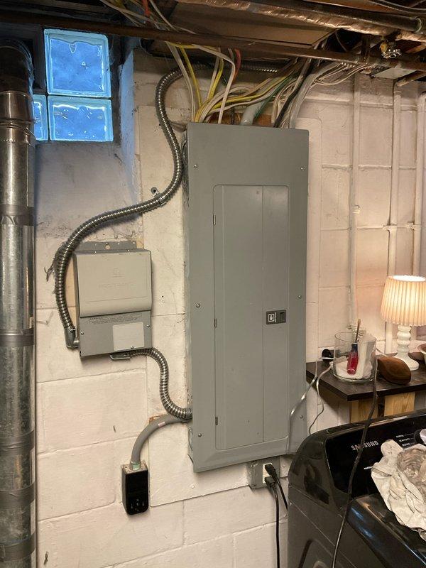 Conducted water heater assessment for a failing Lochinvar unit located in the utility room. Documented existing installation including copper piping connections and nearby electrical panel configuration. Provided customer with replacement options and comprehensive estimate for complete water heater system replacement.