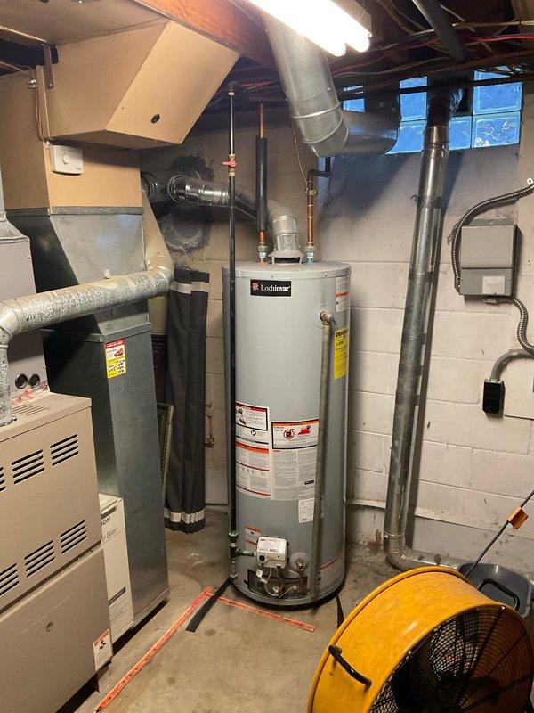Conducted water heater assessment for a failing Lochinvar unit located in the utility room. Documented existing installation including copper piping connections and nearby electrical panel configuration. Provided customer with replacement options and comprehensive estimate for complete water heater system replacement.
