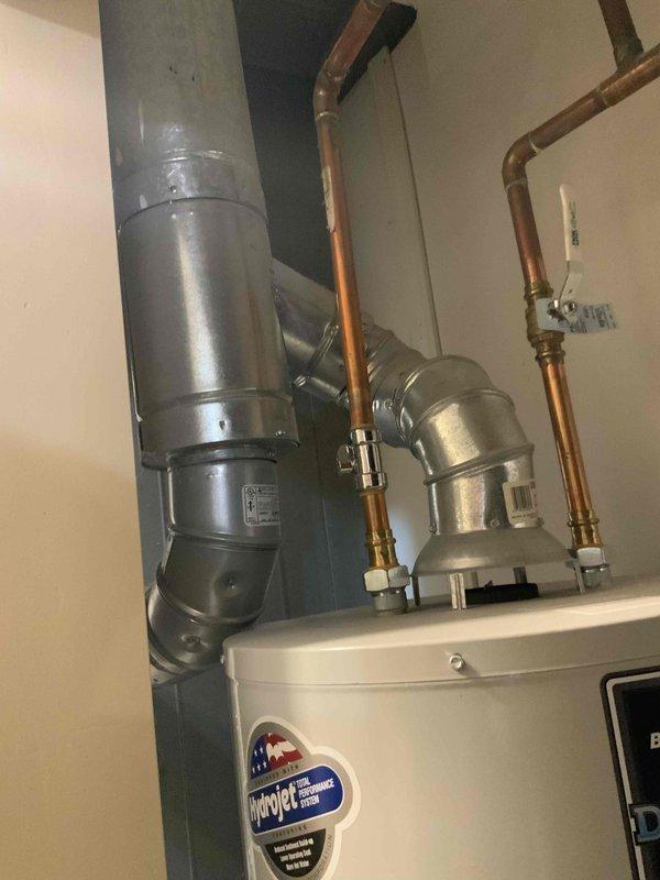 Provided estimate for replacement of 15-year-old furnace and non-functioning A/C system located in utility room. Inspection revealed existing installation with copper plumbing connections and vertical ductwork that would need to be integrated with new equipment. Quote #126478-01 prepared after thorough assessment of the space constraints and current system configuration.