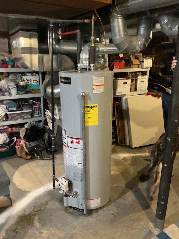 Performed comprehensive assessment of leaking water heater located in basement storage area. Evaluated electrical panel connections and inspected existing unit, which showed signs of failure requiring replacement. Documented current installation configuration including supply lines, drain connections, and electrical requirements to prepare accurate estimate for water heater replacement service.