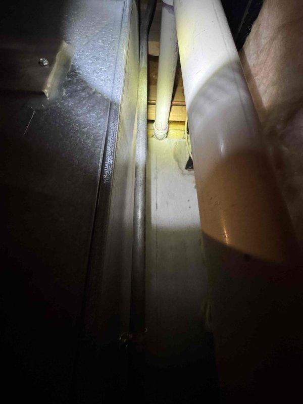 Conducted inspection of 20-year-old AC system for replacement estimate as requested by homeowner. Documented existing installation in confined mechanical space, noting current condensate pump configuration and ventilation ducting. System has reached end of service life and replacement options were evaluated based on site conditions.