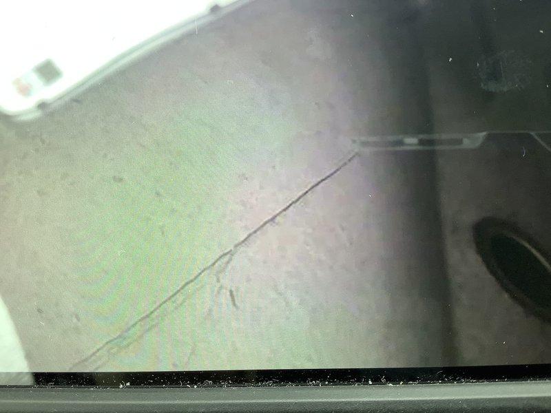 Performed inspection of 17-year-old furnace to verify previous company's diagnosis of heat exchanger damage. Visual examination confirmed presence of a crack/ring in the heat exchanger, validating the recommendation for replacement. Current unit is operational but poses safety concerns due to compromised heat exchanger integrity.