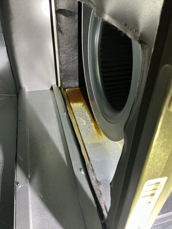 Responded to customer complaint of water leakage and rust under a 2022 furnace located in the basement. Diagnostic inspection revealed corrosion buildup along the seam where the circular vent component meets the housing, likely causing the reported water leakage. Performed necessary repairs under existing parts and labor warranty.