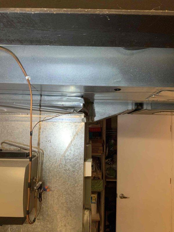 Conducted comprehensive assessment of existing HVAC system in basement, including aging natural gas furnace and associated ductwork. Documented current system configuration with particular attention to the metal ductwork connections and refrigerant lines. Customer expressed interest in BOGO promotion and financing options for complete system replacement.