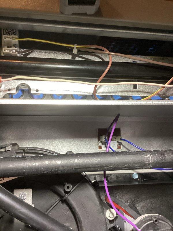 Performed scheduled Air Care Heating maintenance service, including full inspection of furnace system components. Examined electrical connections, blower assembly, and control modules for proper operation, confirming all wiring (including yellow, pink, purple, red, and blue connections) was secure and in good condition. Verified ignition elements and flame sensors were functioning correctly with no signs of damage or abnormal wear.