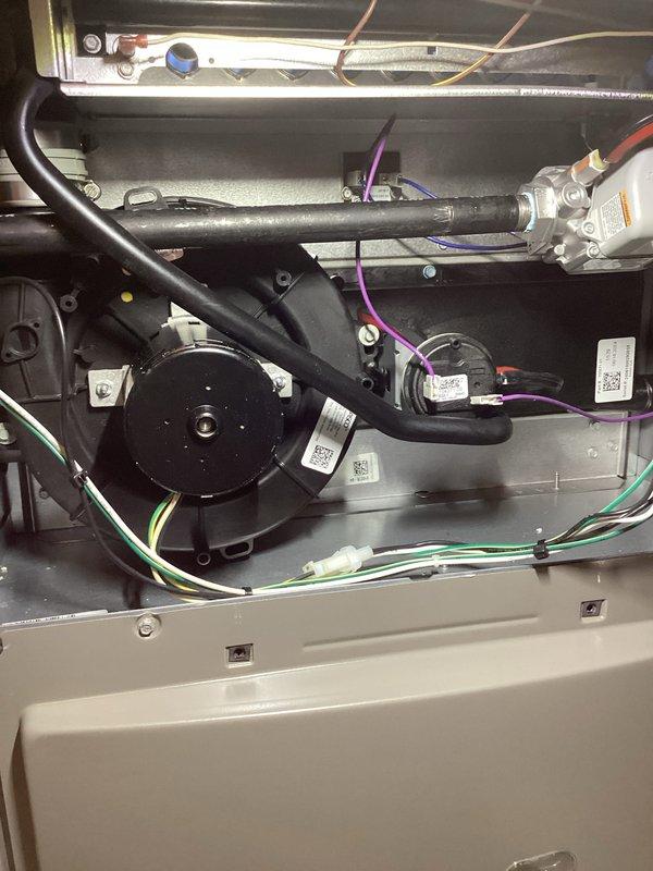 Performed scheduled Air Care Heating maintenance service, including full inspection of furnace system components. Examined electrical connections, blower assembly, and control modules for proper operation, confirming all wiring (including yellow, pink, purple, red, and blue connections) was secure and in good condition. Verified ignition elements and flame sensors were functioning correctly with no signs of damage or abnormal wear.
