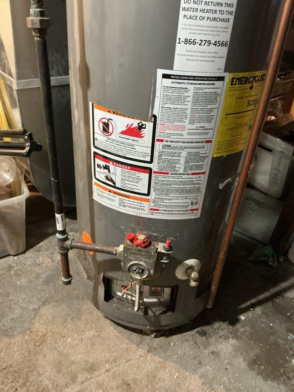 # Service Report: Tanked Water Heater Diagnostic

Responded to service call for a Performa brand tanked water heater with pilot light failure. Performed diagnostic evaluation of the unit's gas control system, thermocouple, and ignition components. Inspected the water heater installation including copper supply piping, temperature and pressure relief valve connections, and gas line configuration. Assessed the overall condition of the tank, control assembly with red gas valve handle, and related plumbing connections. 

Diagnosed pilot light assembly malfunction preventing sustained ignition. Customer declined repair and opted for diagnostic service only with no parts or labor warranty.
