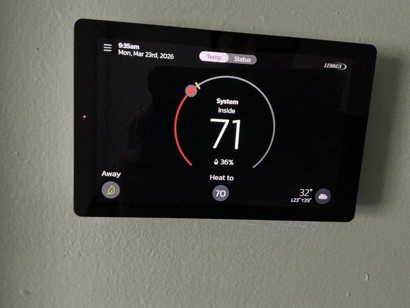 # Service Summary

Completed scheduled ComfortGuard preventive maintenance visit on residential HVAC system. Provided customer education on humidifier pad replacement procedure as requested.

# Work Performed

Performed comprehensive system inspection and maintenance on Lennox HVAC equipment. Verified thermostat operation and settings, confirming proper temperature control at 70°F heat setpoint with current indoor temperature reading of 71°F and 36% relative humidity. Outdoor temperature registered at 32°F during service visit.

Conducted electrical diagnostics on outdoor condensing unit using digital clamp meter. Measured amperage draw and verified readings within manufacturer specifications at 399 counts. Inspected condenser coil fins for debris and damage, confirming adequate airflow through heat exchanger.

Provided hands-on customer training for humidifier pad maintenance as specifically requested. Demonstrated proper removal and installation techniques for humidifier media, inclu