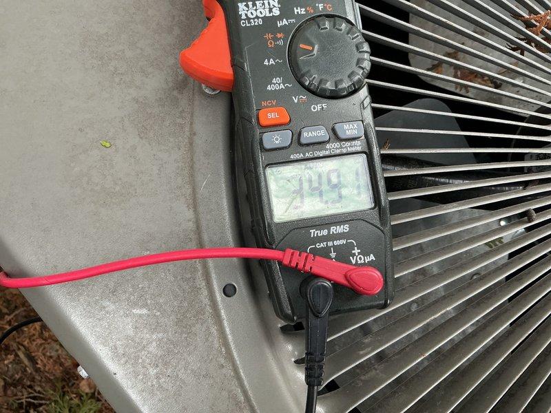 # Service Summary

Completed scheduled ComfortGuard preventive maintenance visit on residential HVAC system. Provided customer education on humidifier pad replacement procedure as requested.

# Work Performed

Performed comprehensive system inspection and maintenance on Lennox HVAC equipment. Verified thermostat operation and settings, confirming proper temperature control at 70°F heat setpoint with current indoor temperature reading of 71°F and 36% relative humidity. Outdoor temperature registered at 32°F during service visit.

Conducted electrical diagnostics on outdoor condensing unit using digital clamp meter. Measured amperage draw and verified readings within manufacturer specifications at 399 counts. Inspected condenser coil fins for debris and damage, confirming adequate airflow through heat exchanger.

Provided hands-on customer training for humidifier pad maintenance as specifically requested. Demonstrated proper removal and installation techniques for humidifier media, inclu