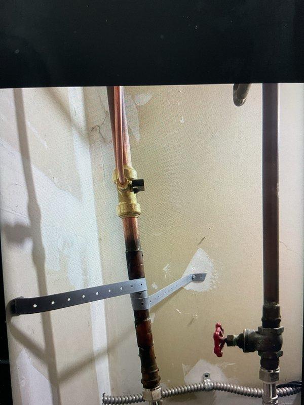 # HVAC Install Warranty Service Summary

Completed installation of 90,000 BTU furnace and 3.5-ton rear-discharge air conditioning system per approved specifications. Installation included integration of humidifier unit with proper water supply connection and reconnection of existing system components. All required mechanical and electrical permits were secured prior to installation. Plumbing connections were established using copper supply lines with appropriate shut-off valves and flexible metal connectors for humidifier feed line. System was properly mounted, secured, and tested for operational functionality. Installation photos document completed plumbing connections, including brass valves, copper piping, and flexible supply lines mounted to wall with appropriate securing hardware. A follow-up service appointment has been scheduled to inspect for potential water hammer noise from the humidifier feed line and install water hammer arrestor if needed to eliminate pressure surge issues