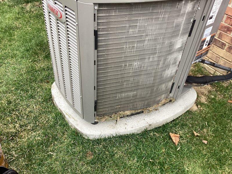 # ComfortGuard Maintenance Service Completed

Performed comprehensive preventive maintenance on residential Lennox HVAC system including both heating and cooling components. Replaced furnace filter and humidifier pad as requested by customer prior to appointment. Conducted thorough inspection of outdoor condenser unit, noting minor debris accumulation on coil fins typical of normal operation. Unit positioned on curved concrete pad showed standard weathering with all mechanical components operating within manufacturer specifications. Verified proper refrigerant line connections and electrical conduit integrity at exterior installation point. System tested and confirmed operational for continued reliable performance.