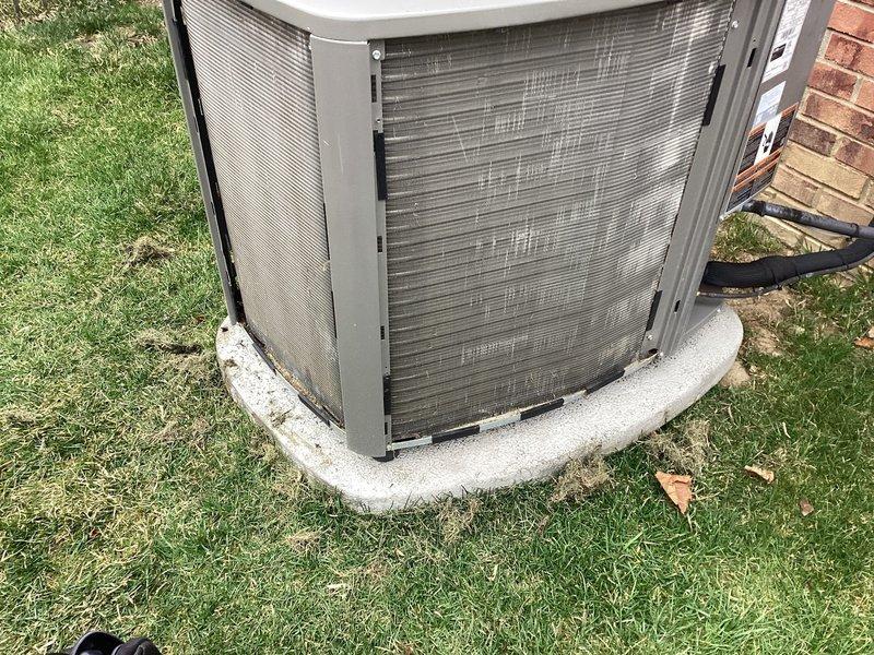 # ComfortGuard Maintenance Service Completed

Performed comprehensive preventive maintenance on residential Lennox HVAC system including both heating and cooling components. Replaced furnace filter and humidifier pad as requested by customer prior to appointment. Conducted thorough inspection of outdoor condenser unit, noting minor debris accumulation on coil fins typical of normal operation. Unit positioned on curved concrete pad showed standard weathering with all mechanical components operating within manufacturer specifications. Verified proper refrigerant line connections and electrical conduit integrity at exterior installation point. System tested and confirmed operational for continued reliable performance.